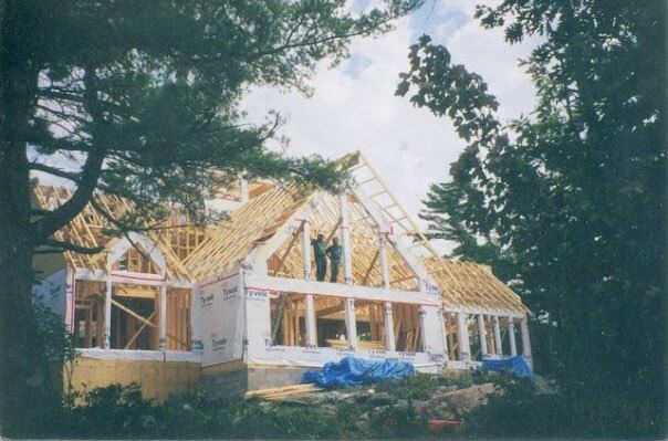 Paul and a friend framing a cottage